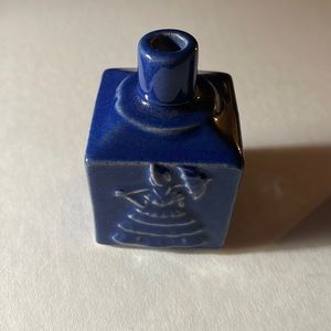 Small blue vase girl with umbrella